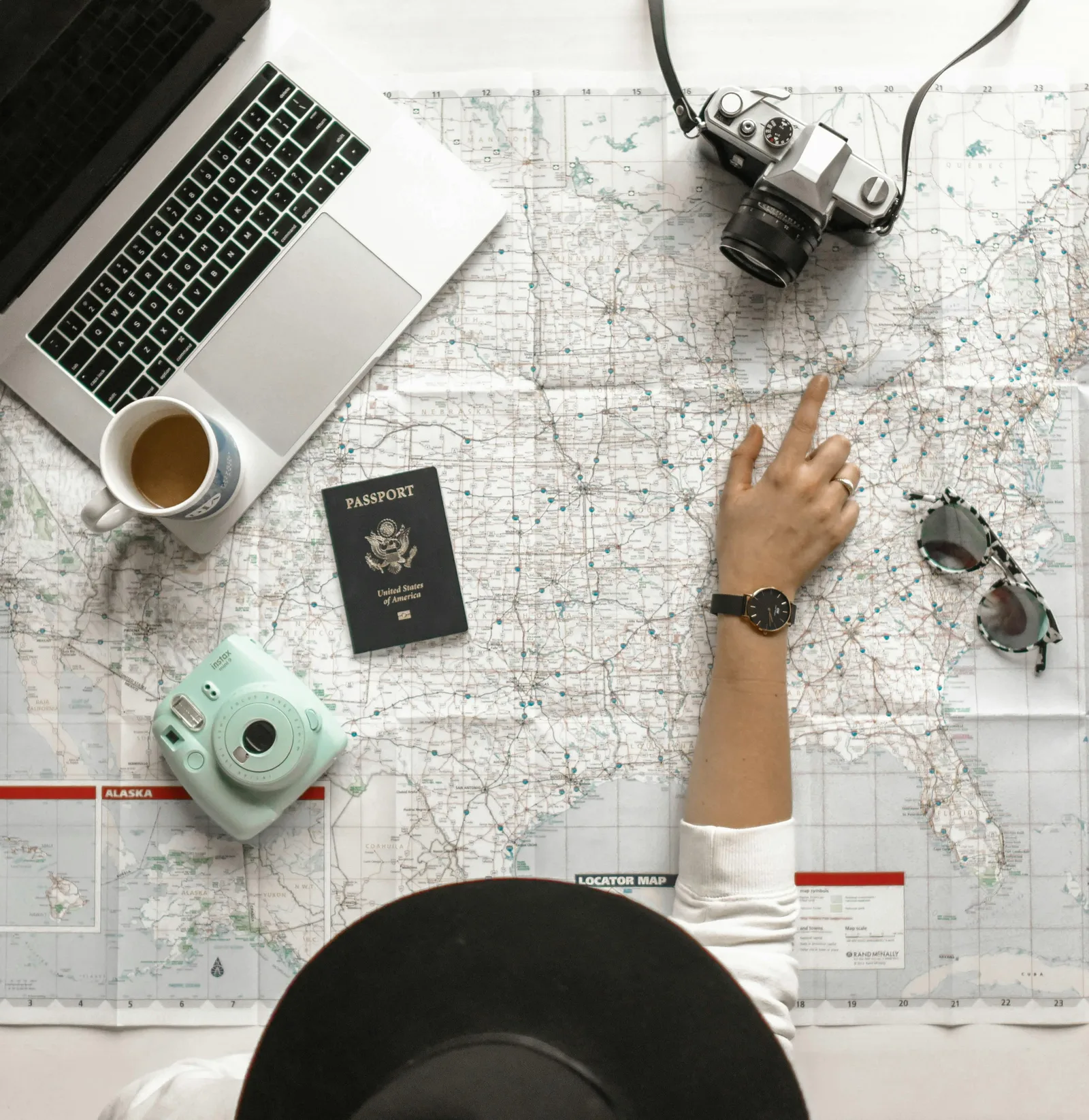 Woman planning travel with passport and apps