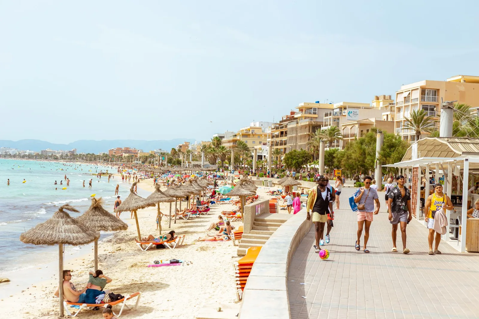 A busy Ibiza beach on a sunny day